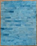 Tapete em Patchwork de couro em tons de azul degradê, verso forrado em tecido com logotipo da Casa Empório Tapetes - Rio Grande do Sul - med. 397 x 293 cm - (com desgastes de uso).